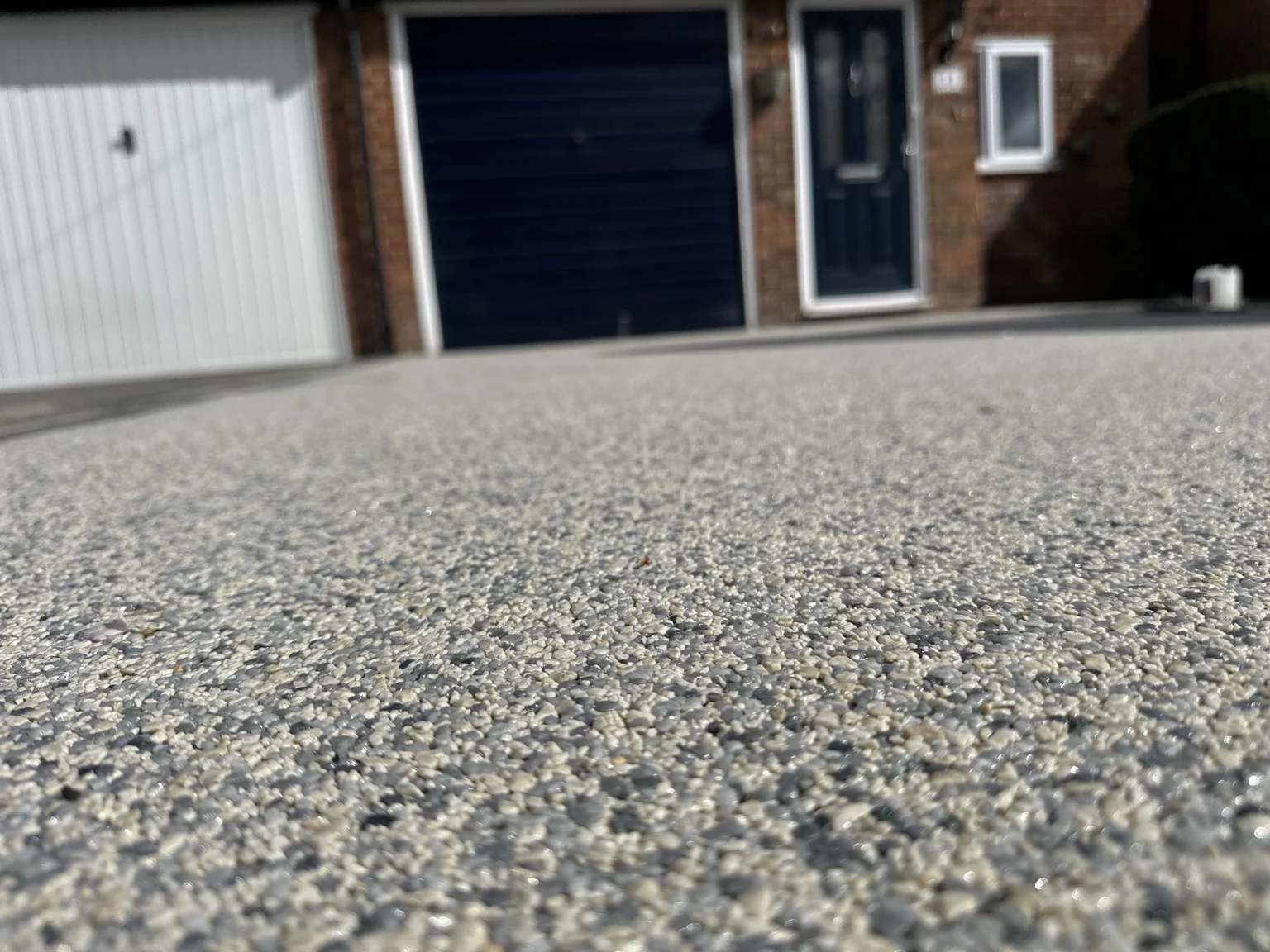 Close-up of light resin bound aggregate on a driveway